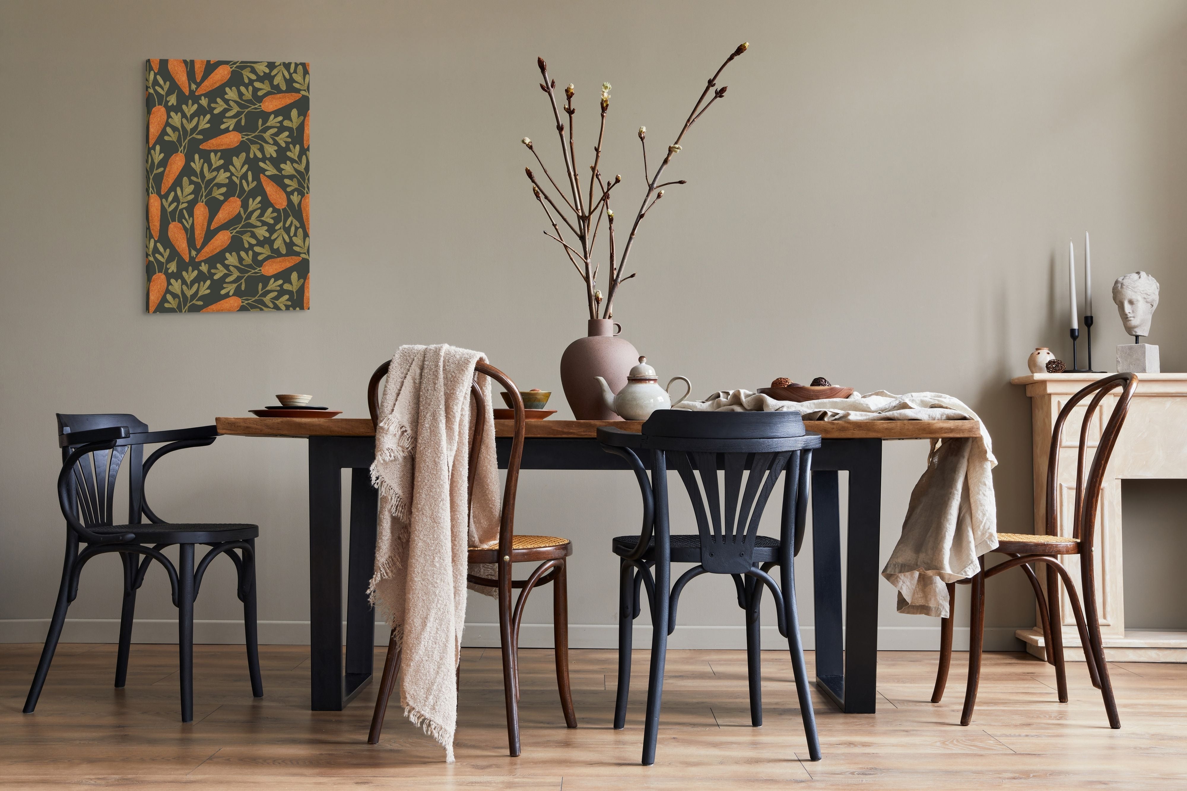 20x30 vertical Whelhung canvas of a pattern of cottagecore carrots hung over a dining room table to bring a touch of spring to the atmosphere