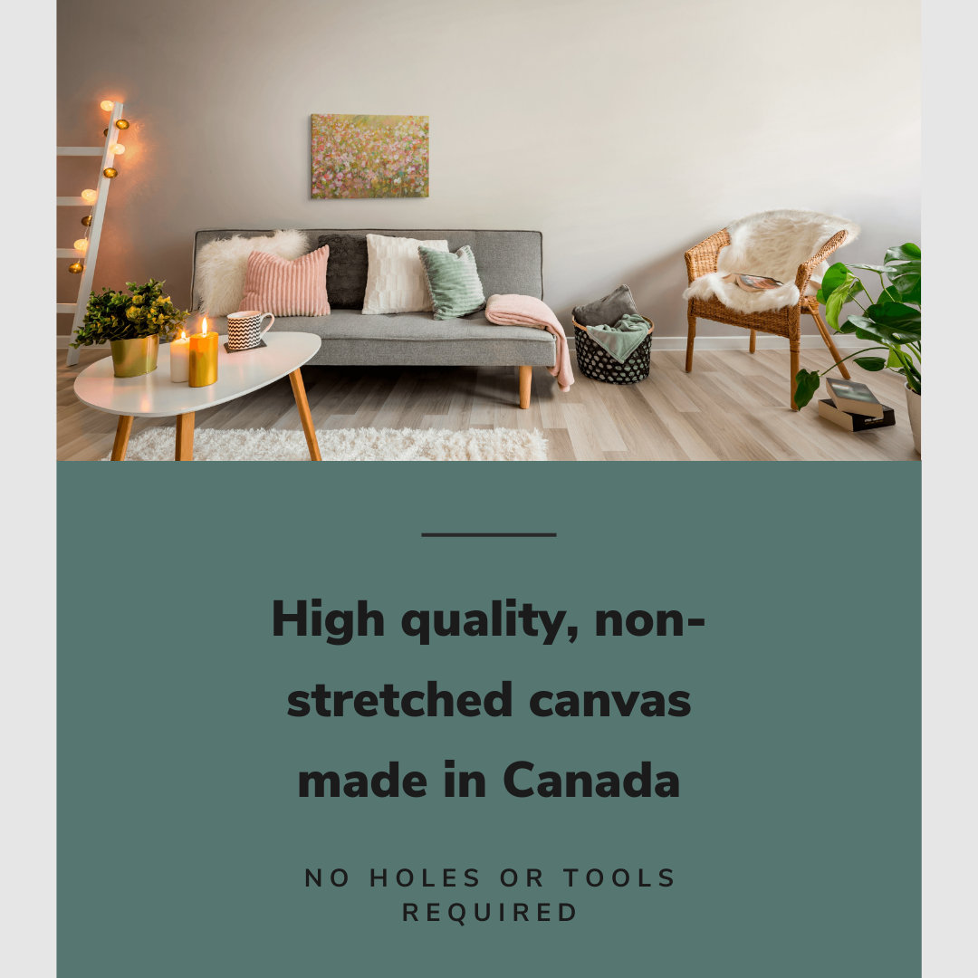 Lifestyle image of the vertical, 16x24 inch easy to hang canvas wall art hung in in a modern living room hung above a couch with a spring colored pillows with graphic saying "High quality, non-stretched canvas made in Canada"