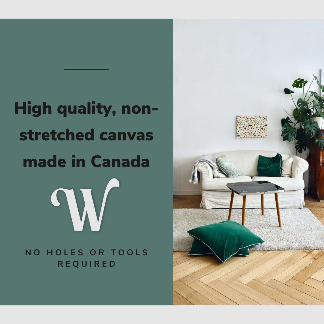 Lifestyle image of the vertical, 12x18 inch easy to hang canvas wall art hung in in a modern living room hung above a couch with a forest green pillow with graphic saying "High quality, non-stretched canvas made in Canada"