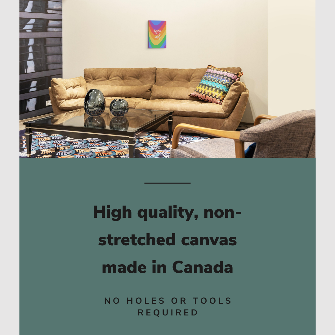 Lifestyle image of the vertical, 12x18 inch easy to hang canvas wall art hung in hung in a basement living room above a leather couch with a rainbow pillow on it with graphic saying "High quality, non-stretched canvas made in Canada"