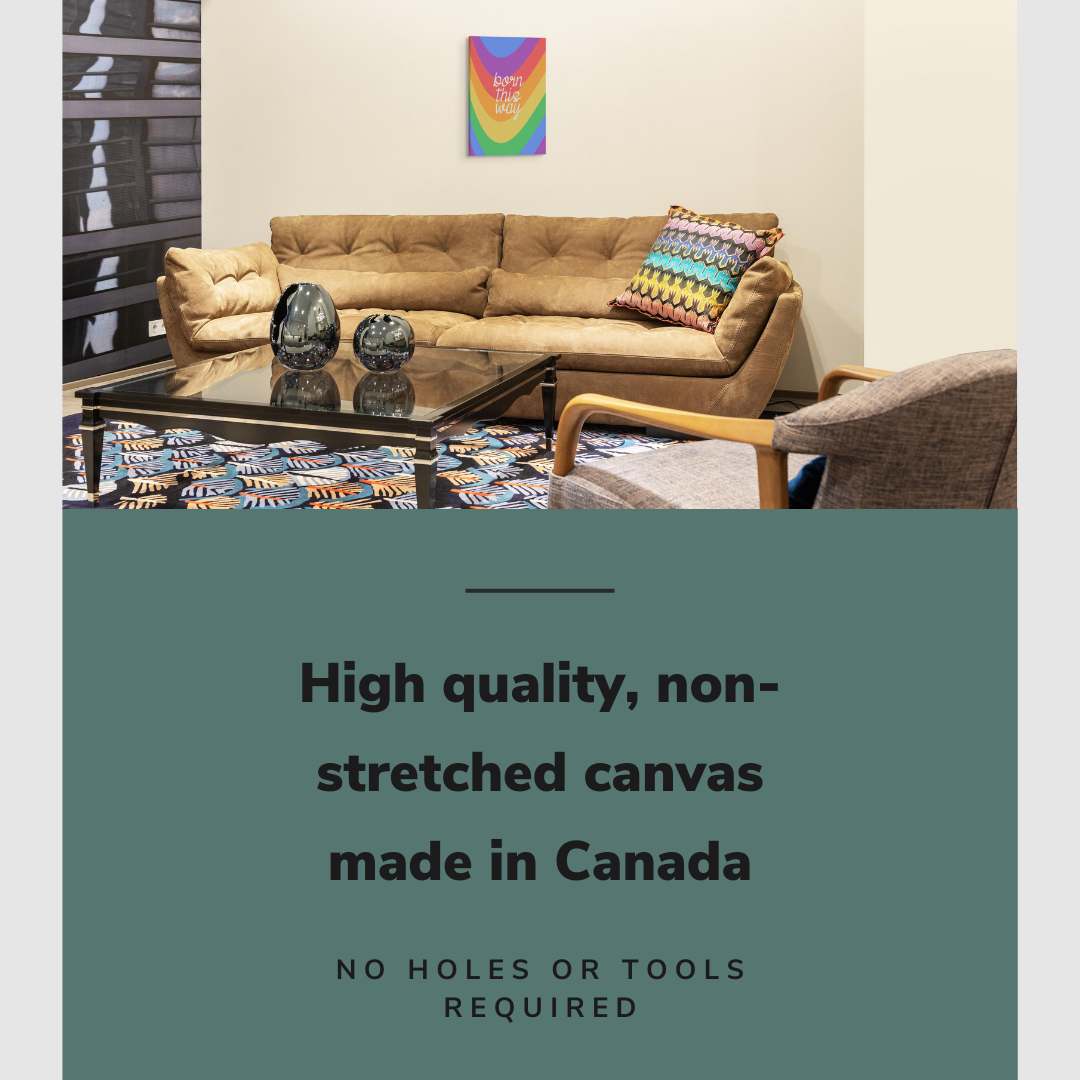 Lifestyle image of the vertical, 16x24 inch easy to hang canvas wall art hung in hung in a basement living room above a leather couch with a rainbow pillow on it with graphic saying "High quality, non-stretched canvas made in Canada"