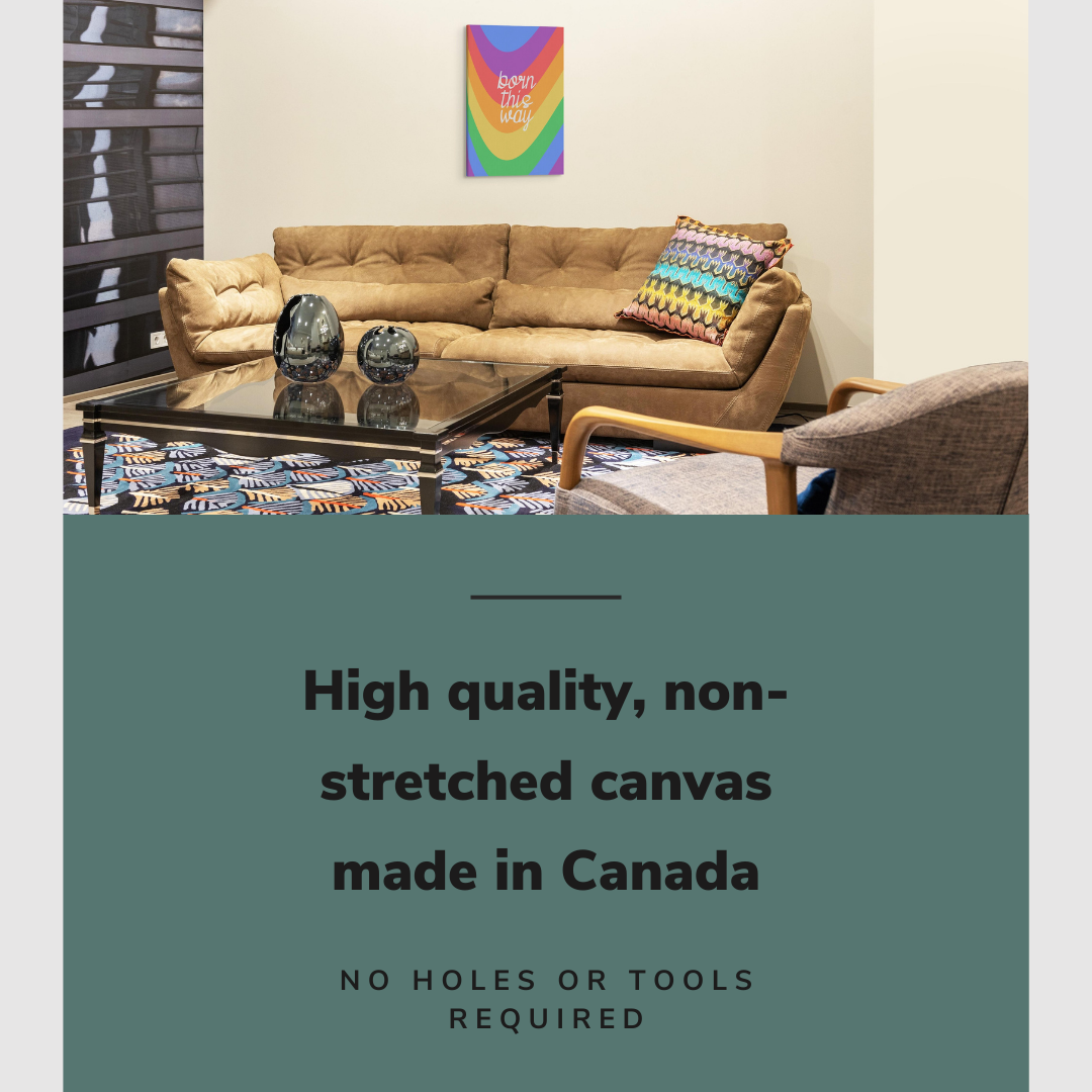 Lifestyle image of the vertical, 20x30 inch easy to hang canvas wall art hung in hung in a basement living room above a leather couch with a rainbow pillow on it with graphic saying "High quality, non-stretched canvas made in Canada"