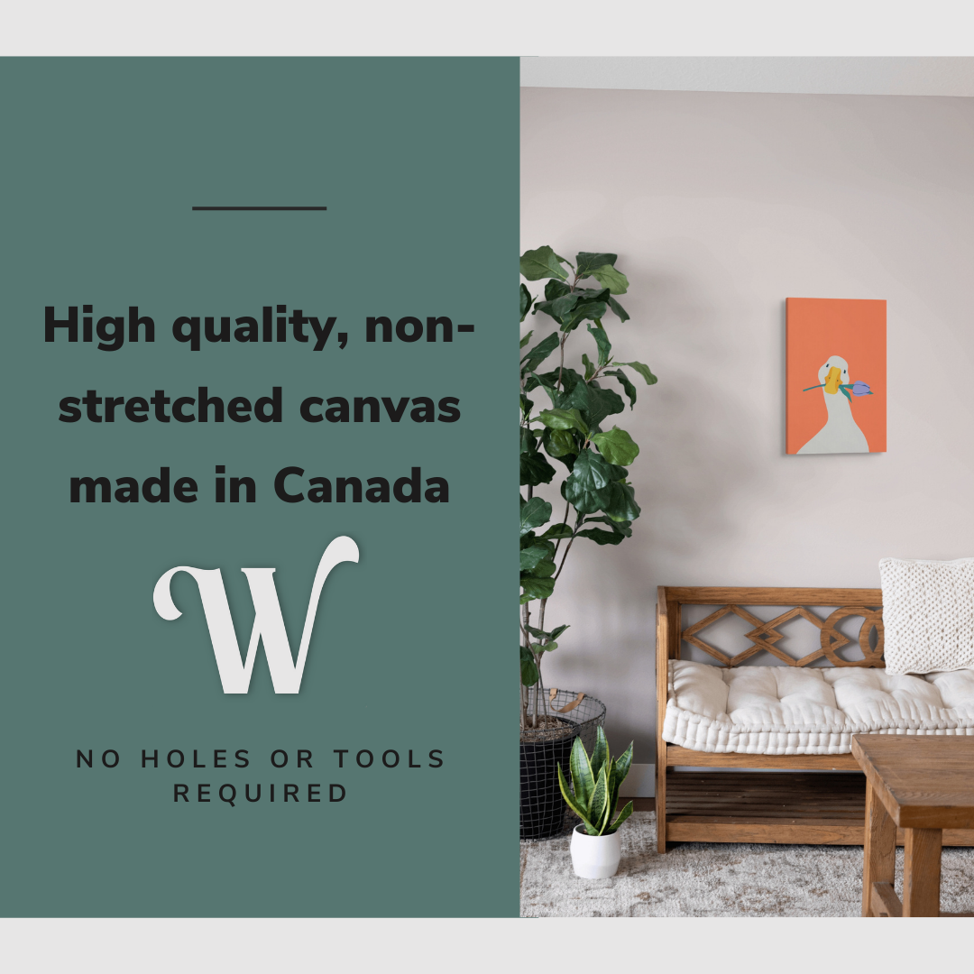 Lifestyle image of the vertical, 12x18 inch easy to hang canvas wall art hung in hung in a minimalist living room above a couch with graphic saying "High quality, non-stretched canvas made in Canada"