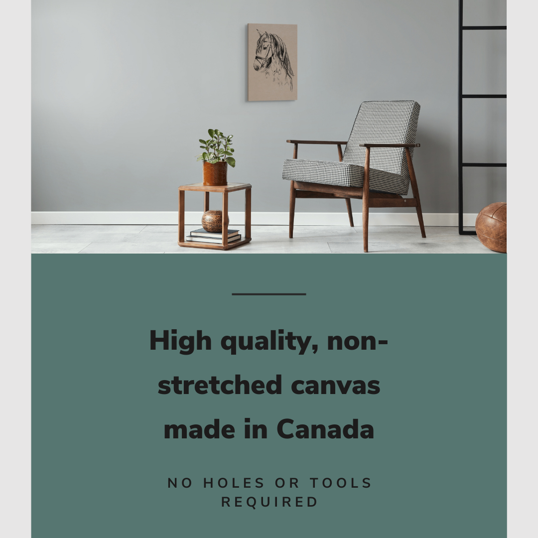 Lifestyle image of the vertical 16x24” inch easy to hang canvas wall art hung in a living room above a chair and table with graphic saying "High quality, non-stretched canvas made in Canada."