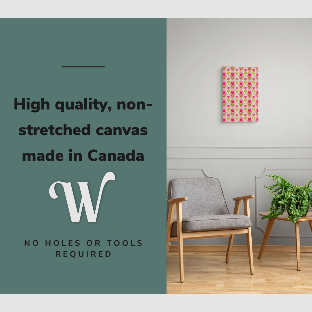 Lifestyle image of the vertical, 12x18 inch easy to hang canvas wall art hung in hung in a minimalist living room above an accent chair with graphic saying "High quality, non-stretched canvas made in Canada"