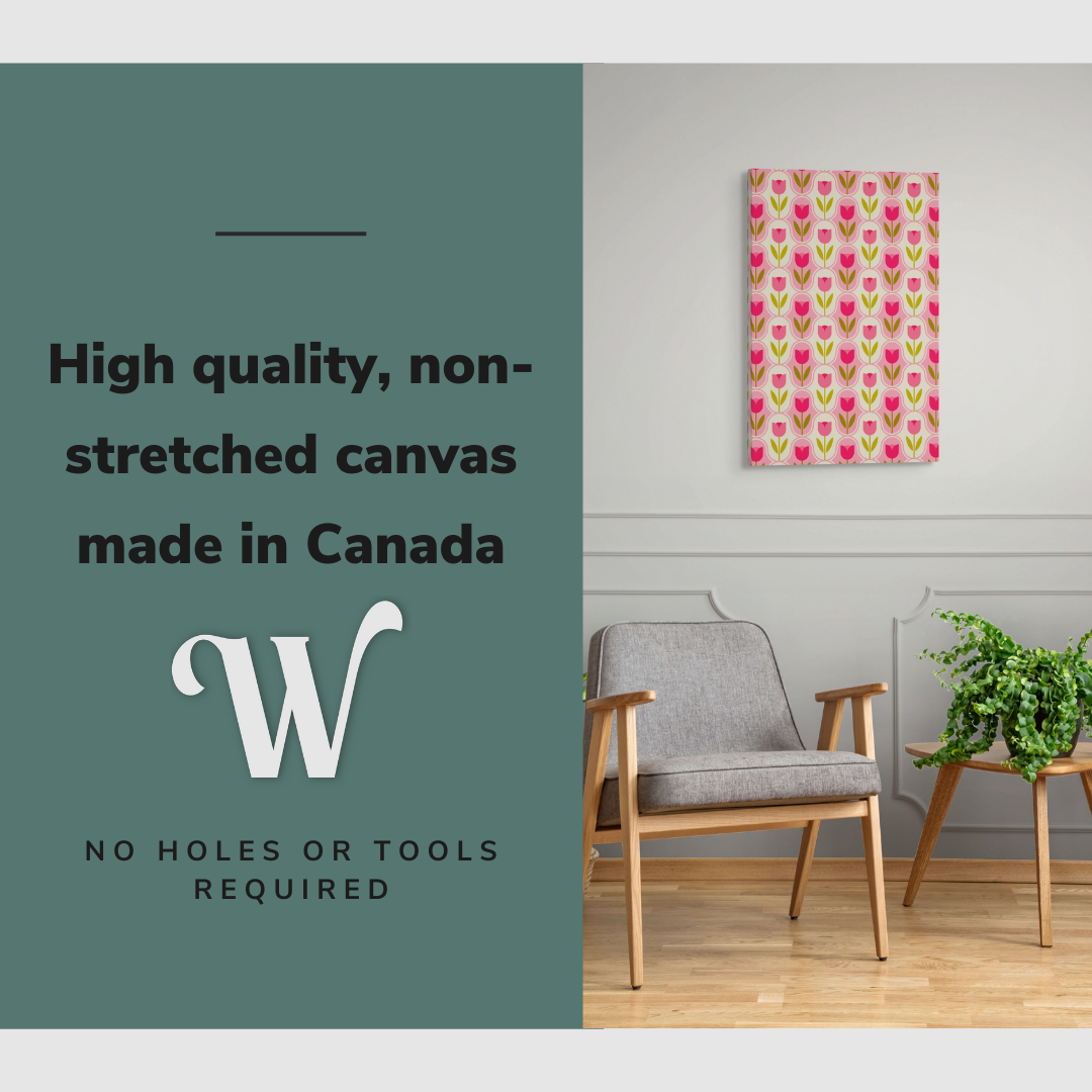 Lifestyle image of the vertical, 20x30 inch easy to hang canvas wall art hung in hung in a minimalist living room above an accent chair with graphic saying "High quality, non-stretched canvas made in Canada"