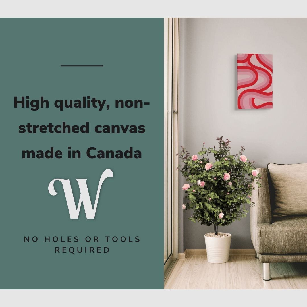 Lifestyle image of the vertical, 12x18 inch easy to hang canvas wall art hung in in a living room hung above a couch and a rose bush with graphic saying "High quality, non-stretched canvas made in Canada"