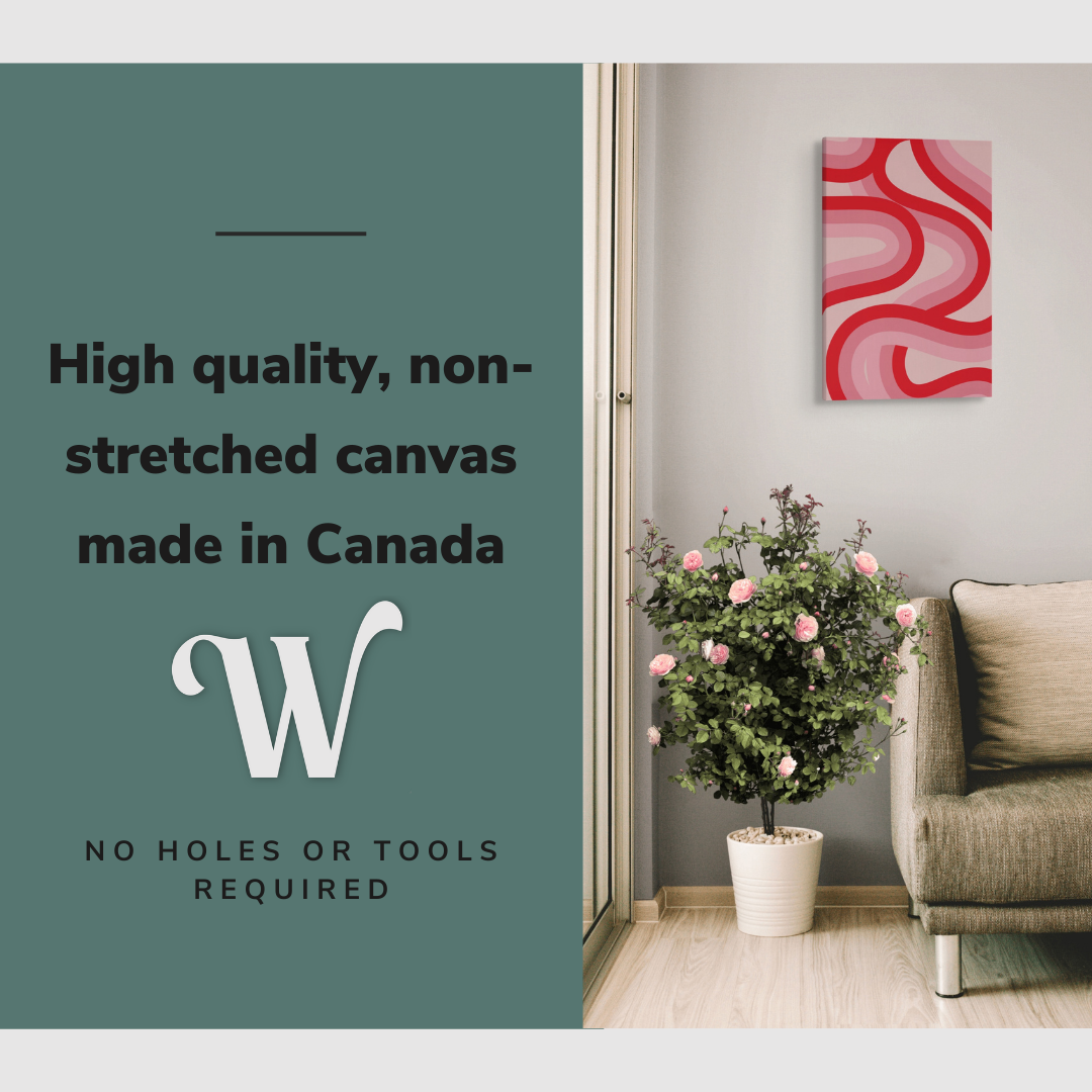 Lifestyle image of the vertical, 16x24 inch easy to hang canvas wall art hung in in a living room hung above a couch and a rose bush with graphic saying "High quality, non-stretched canvas made in Canada"