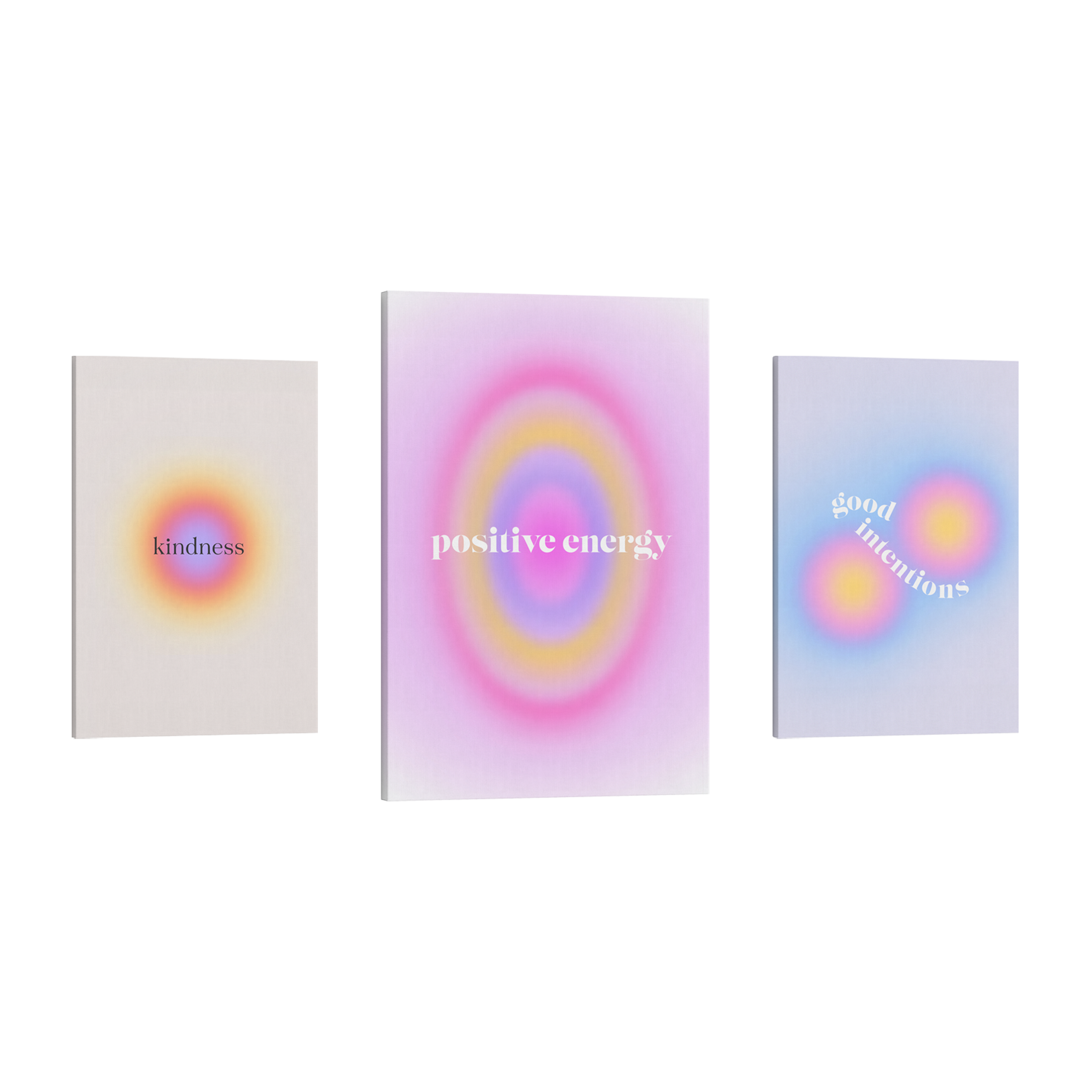 Set of 3, 2:3 vertical easy to hang canvas prints of two different sizes on a transparent background featuring images of gradient auras, the first being 12x18" purple, red and yellow with the word "kindess" in black, the second 16x24" is purple, yellow and darker purple with words in white "positive energy" and the last is another 12x18" with two auras in yellow, pink and blue with words "good intentions" in white