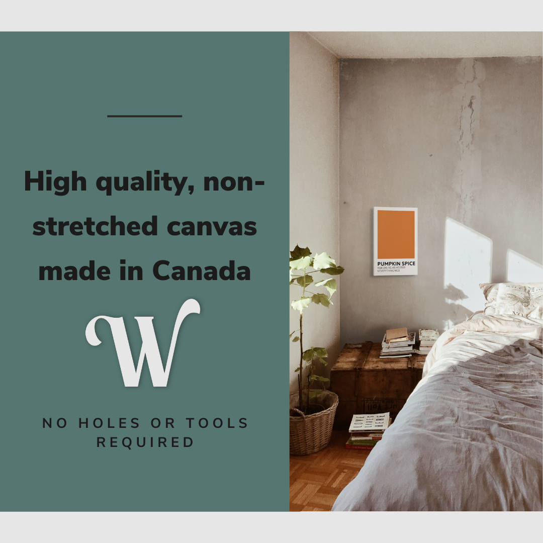 Lifestyle image of the vertical, 12x18 inch easy to hang canvas wall art hung in a cozy bedroom beside the bed and above the side table with graphic saying "High quality, non-stretched canvas made in Canada"