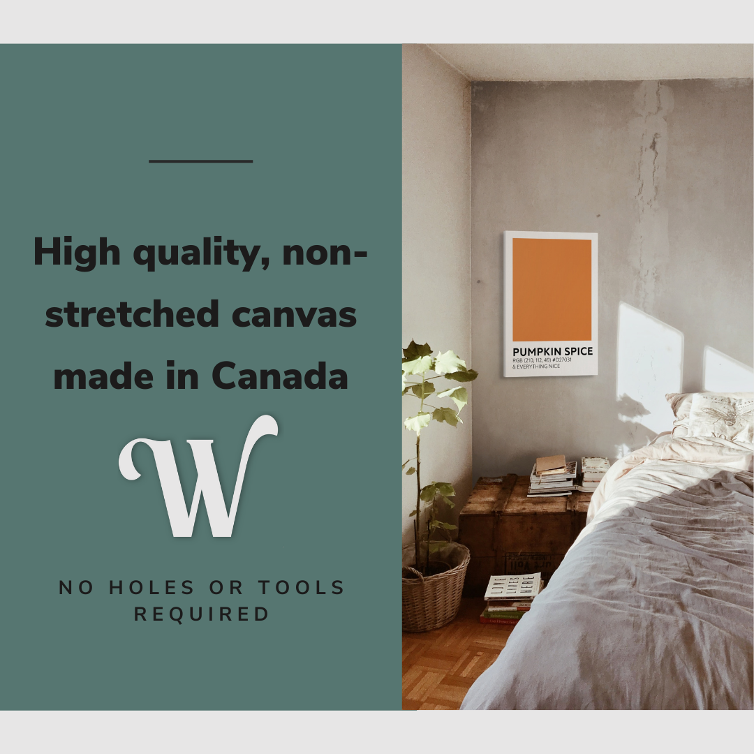 Lifestyle image of the vertical, 20x30 inch easy to hang canvas wall art hung in a cozy bedroom beside the bed and above the side table with graphic saying "High quality, non-stretched canvas made in Canada"