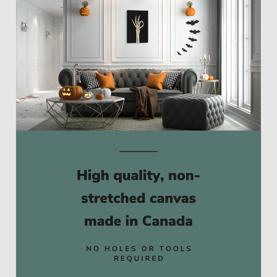 Lifestyle image of the vertical, 20x30” inch easy to hang canvas wall art hung in a Halloween decorated living room above a couch with graphic saying "High quality, non-stretched canvas made in Canada"