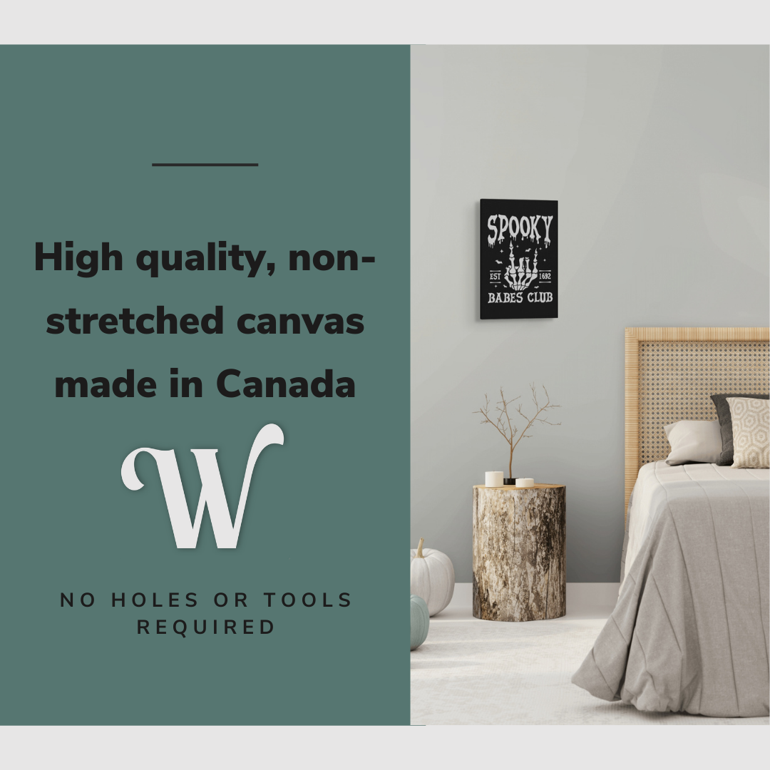 Lifestyle image of the vertical 12x18” inch easy to hang canvas wall art hung over a bedside table beside a bed in a bedroom with graphic saying "High quality, non-stretched canvas made in Canada."