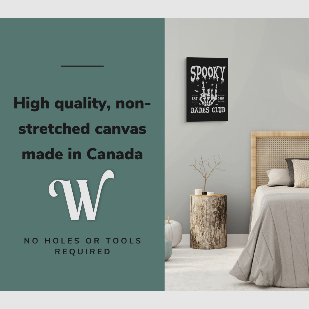 Lifestyle image of the vertical 16x24” inch easy to hang canvas wall art hung in a bedroom above a side table beside a bed with graphic saying "High quality, non-stretched canvas made in Canada."