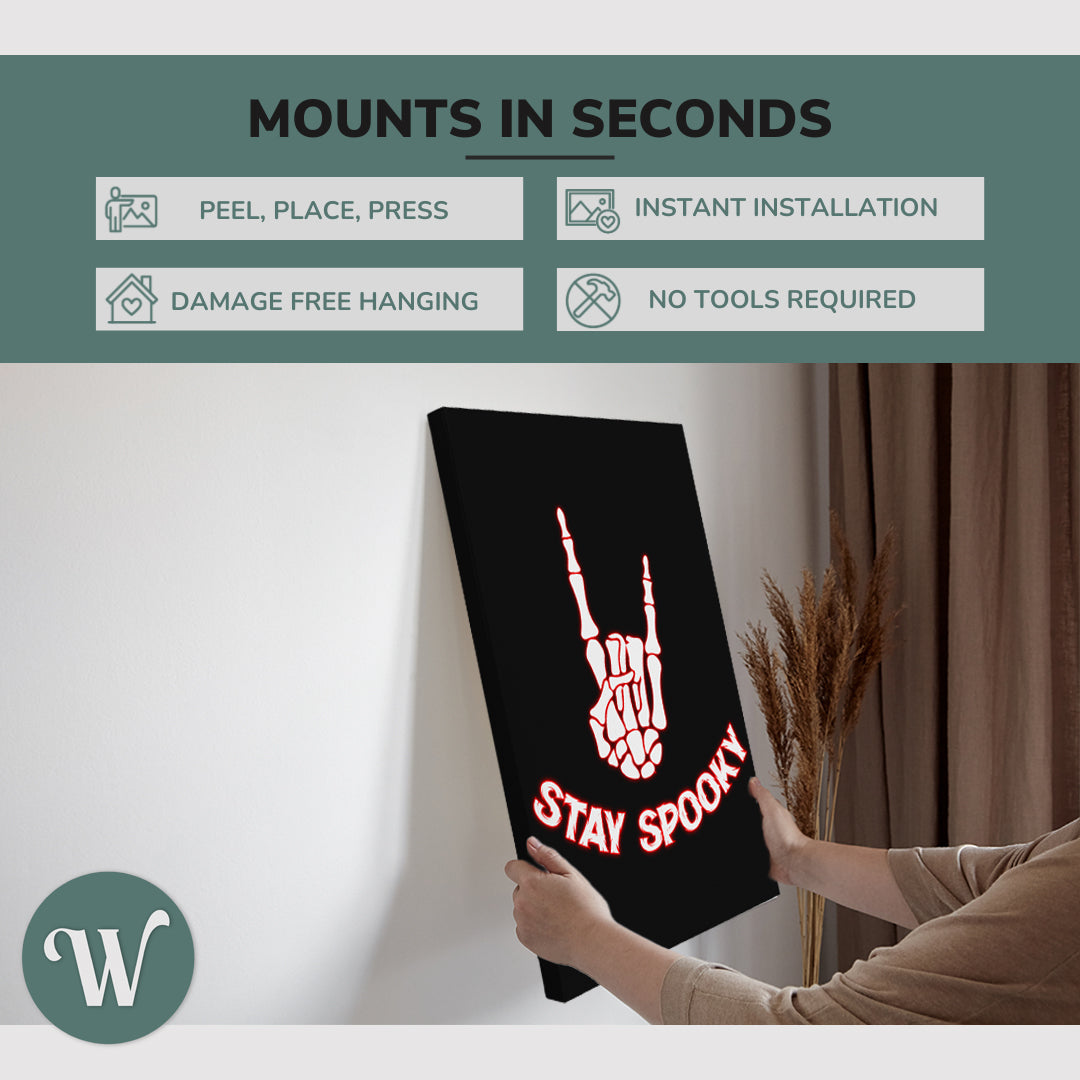 graphic showing hanging a single 2:3 vertical 20x30” inch easy to hang canvas showing how easy it is to hang. Mounts in seconds, "peel, place, press", "instant installation", "damage free hanging" and "no tools required."