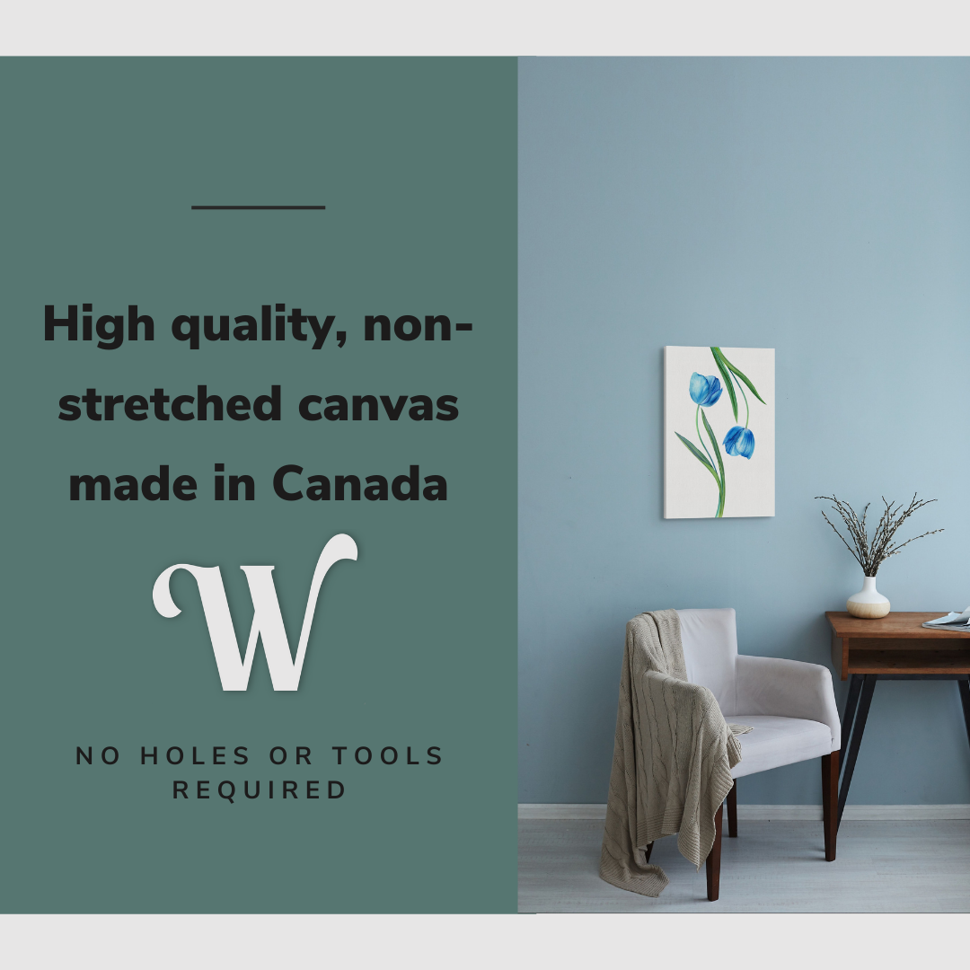 Lifestyle image of the vertical, 12x18 inch easy to hang canvas wall art hung in hung in an minimalist living room above an accent chair with graphic saying "High quality, non-stretched canvas made in Canada"