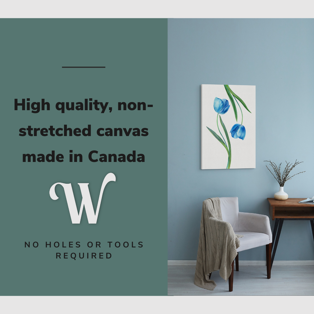 Lifestyle image of the vertical, 20x30 inch easy to hang canvas wall art hung in hung in an minimalist living room above an accent chair with graphic saying "High quality, non-stretched canvas made in Canada"
