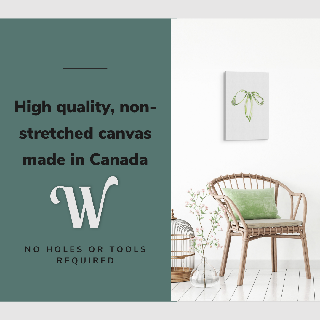 Lifestyle image of the vertical, 12x18 inch easy to hang canvas wall art hung in hung in an minimalist, natural white living room above a green accent chair with graphic saying "High quality, non-stretched canvas made in Canada"