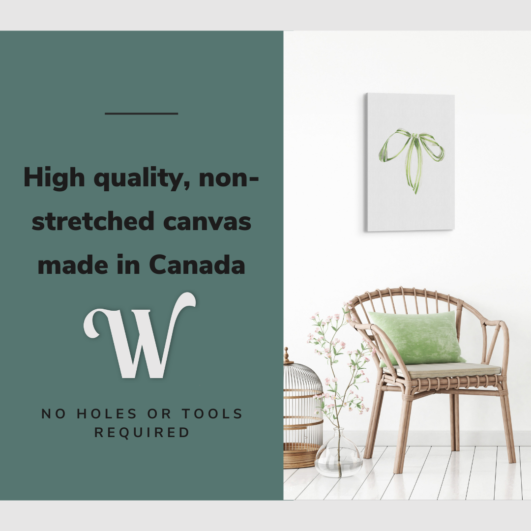 Lifestyle image of the vertical, 16x24 inch easy to hang canvas wall art hung in hung in an minimalist, natural white living room above a green accent chair with graphic saying "High quality, non-stretched canvas made in Canada"