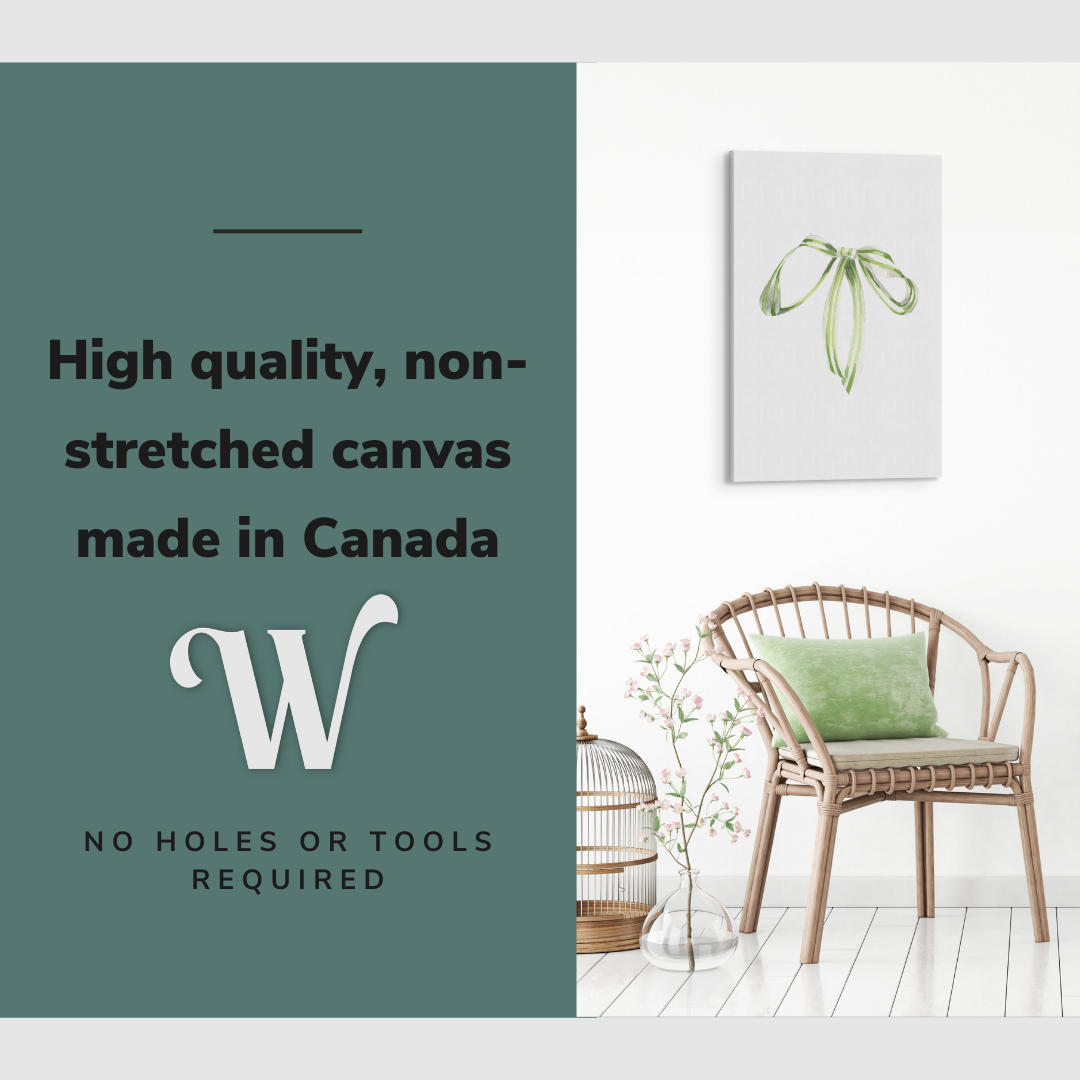 Lifestyle image of the vertical, 20x30 inch easy to hang canvas wall art hung in hung in an minimalist, natural white living room above a green accent chair with graphic saying "High quality, non-stretched canvas made in Canada"