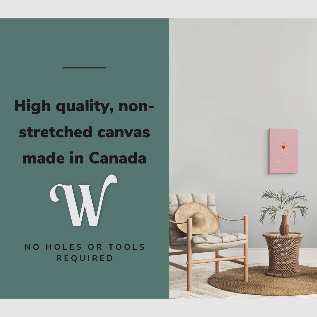 Lifestyle image of the vertical, 12x18 inch easy to hang canvas wall art hung in in a minimalist living room between two beige chairs with graphic saying "High quality, non-stretched canvas made in Canada"