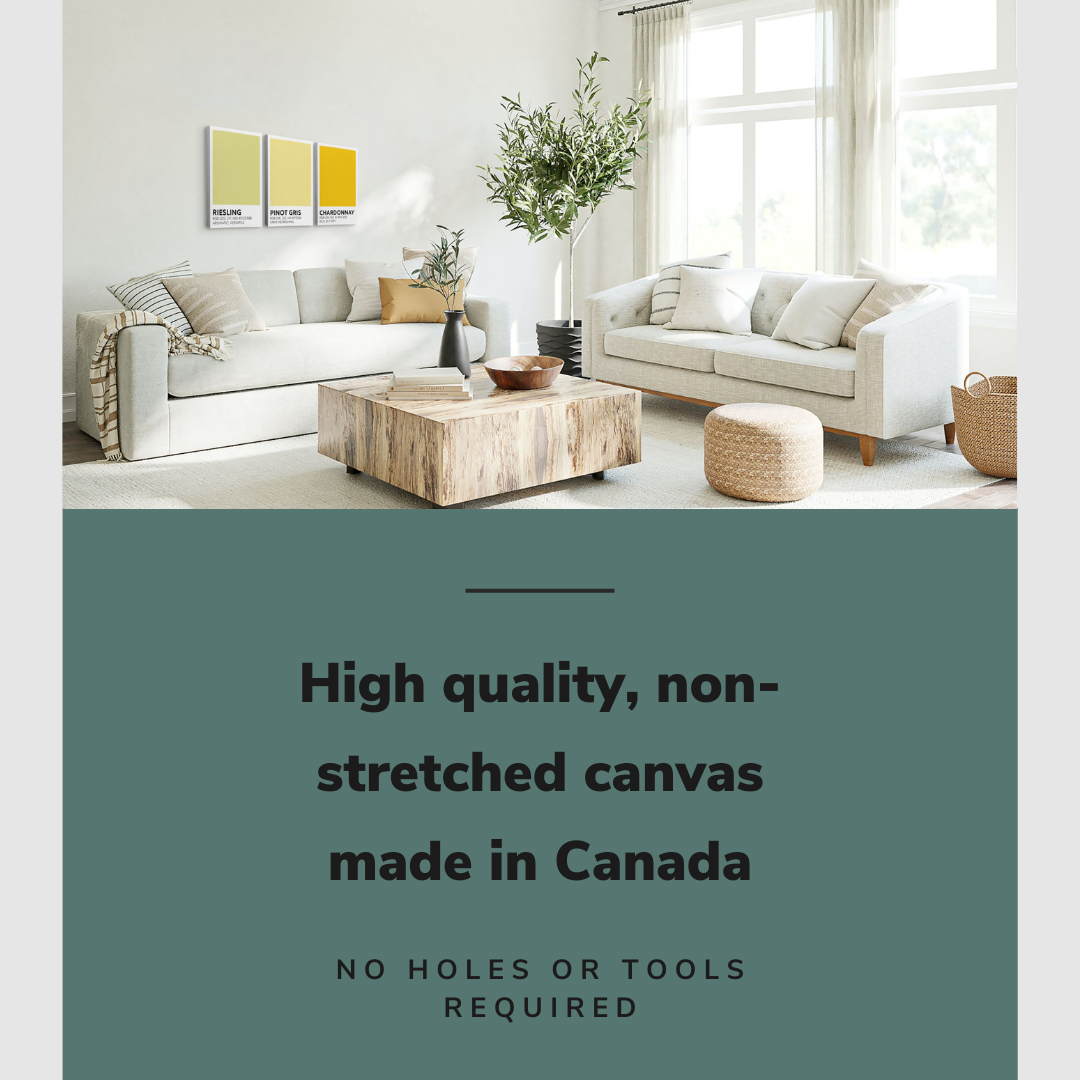 Lifestyle image of the vertical, 12x18 inch easy to hang canvas wall art hung in a living room above a couch and coffee table with graphic saying "High quality, non-stretched canvas made in Canada"