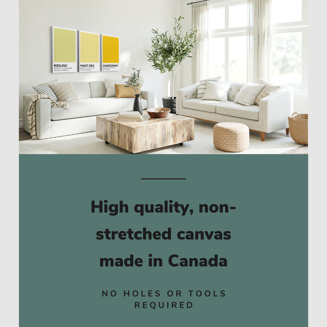Lifestyle image of the vertical, 20x30 inch easy to hang canvas wall art hung in a living room above a couch and coffee table with graphic saying "High quality, non-stretched canvas made in Canada"