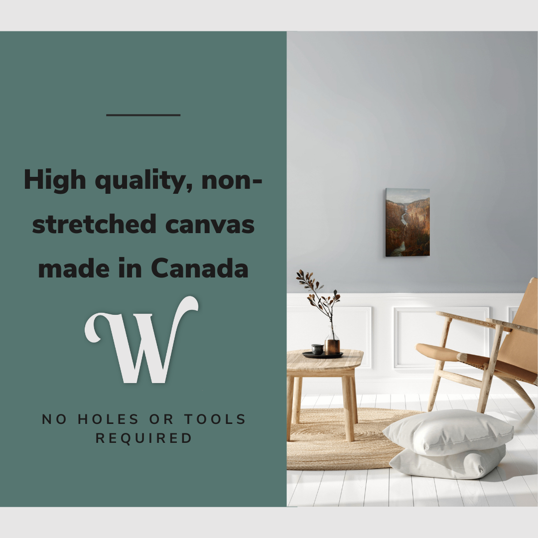 Lifestyle image of the vertical 12x18” inch easy to hang canvas wall art hung in a living room above an accent chair with graphic saying "High quality, non-stretched canvas made in Canada."