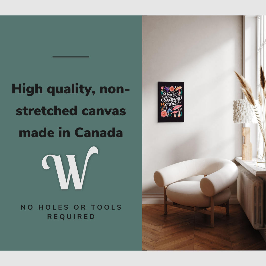 Lifestyle image of the vertical, 12x18 inch easy to hang canvas wall art hung in hung in an minimalist living room above an accent chair with graphic saying "High quality, non-stretched canvas made in Canada"