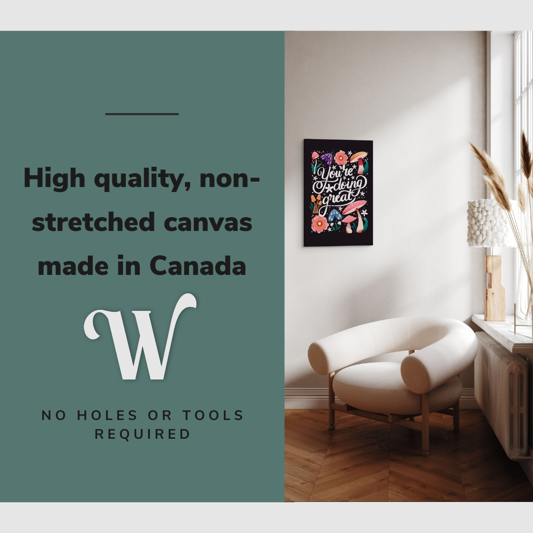 Lifestyle image of the vertical, 16x24 inch easy to hang canvas wall art hung in hung in an minimalist living room above an accent chair with graphic saying "High quality, non-stretched canvas made in Canada"