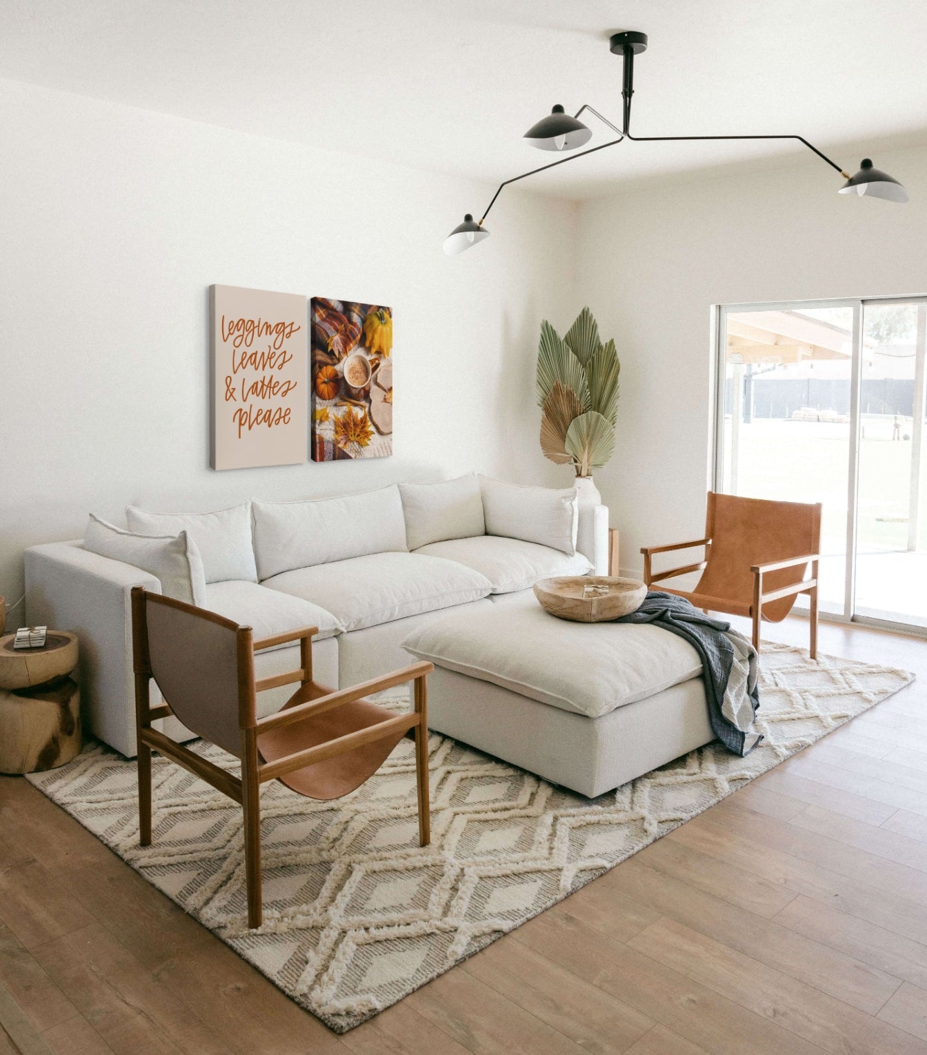 Modern living room with two Whelhung canvases hung above the couch.