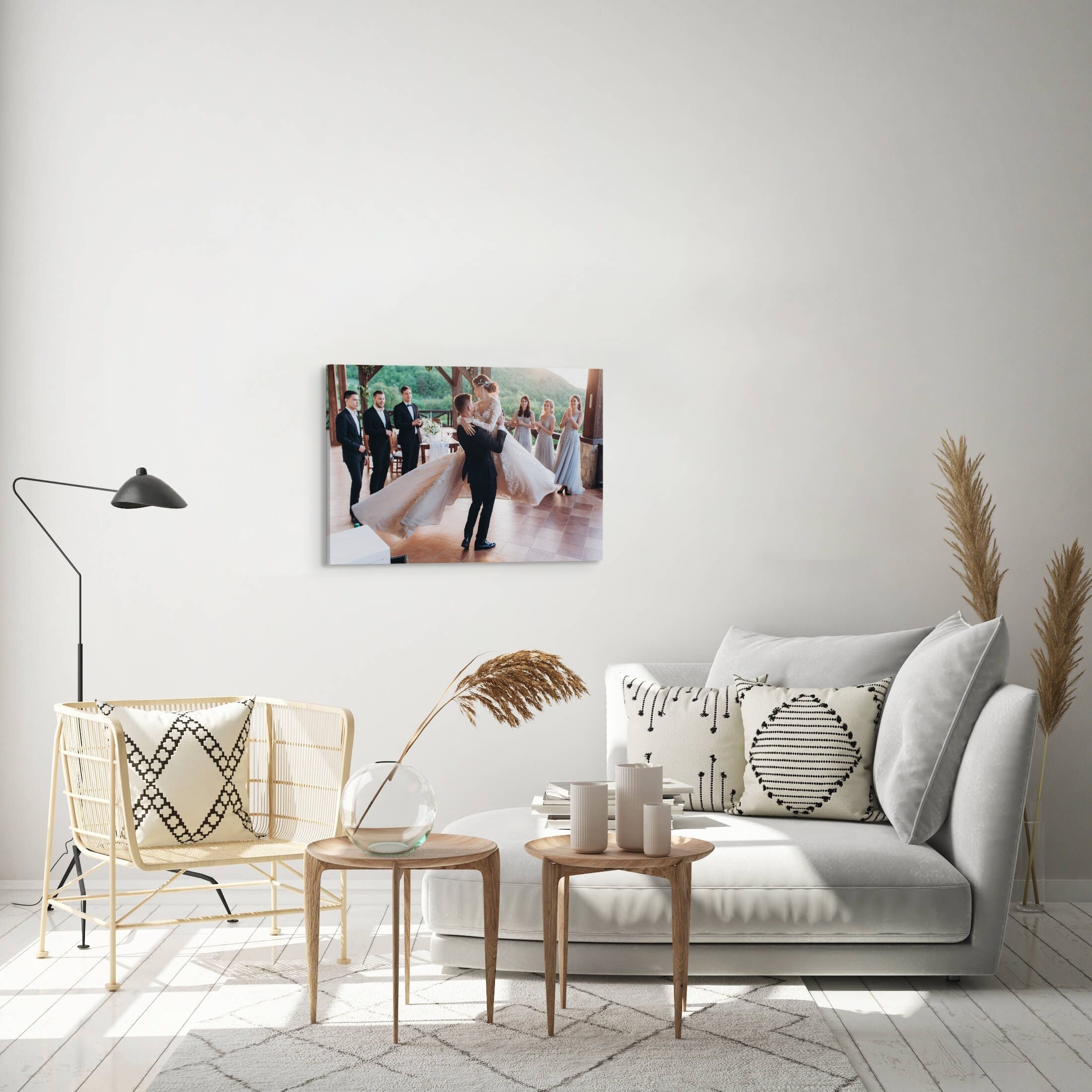 A large, 20x30" inch horizontal easy to hang canvas print featuring a custom, intimate wedding photograph hung above a couch in a living room.