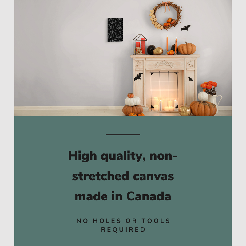 Lifestyle image of the vertical 12x18” inch easy to hang canvas wall art hung in a Halloween decorated living room beside a fireplace with graphic saying "High quality, non-stretched canvas made in Canada."