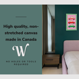 Lifestyle image of the vertical 20x30" inch easy to hang canvas wall art hung in above a bed in a bedroom with graphic saying "High quality, non-stretched canvas made in Canada"