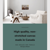 Lifestyle image of the horizontal 16x24” inch easy to hang canvas wall art hung in a living room above a couch with graphic saying "High quality, non-stretched canvas made in Canada."