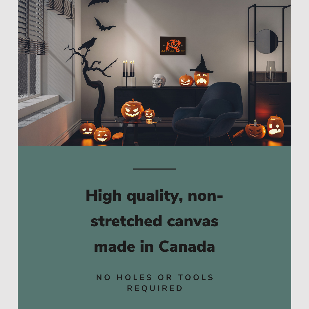 Lifestyle image of the horizontal 12x18” inch easy to hang canvas wall art hung in a Halloween decorated living room above a credenza and reading chair with graphic saying "High quality, non-stretched canvas made in Canada."