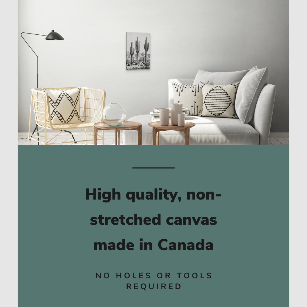 Lifestyle image of the vertical 12x18” inch easy to hang canvas wall art hung in a living room above a couch with graphic saying "High quality, non-stretched canvas made in Canada."