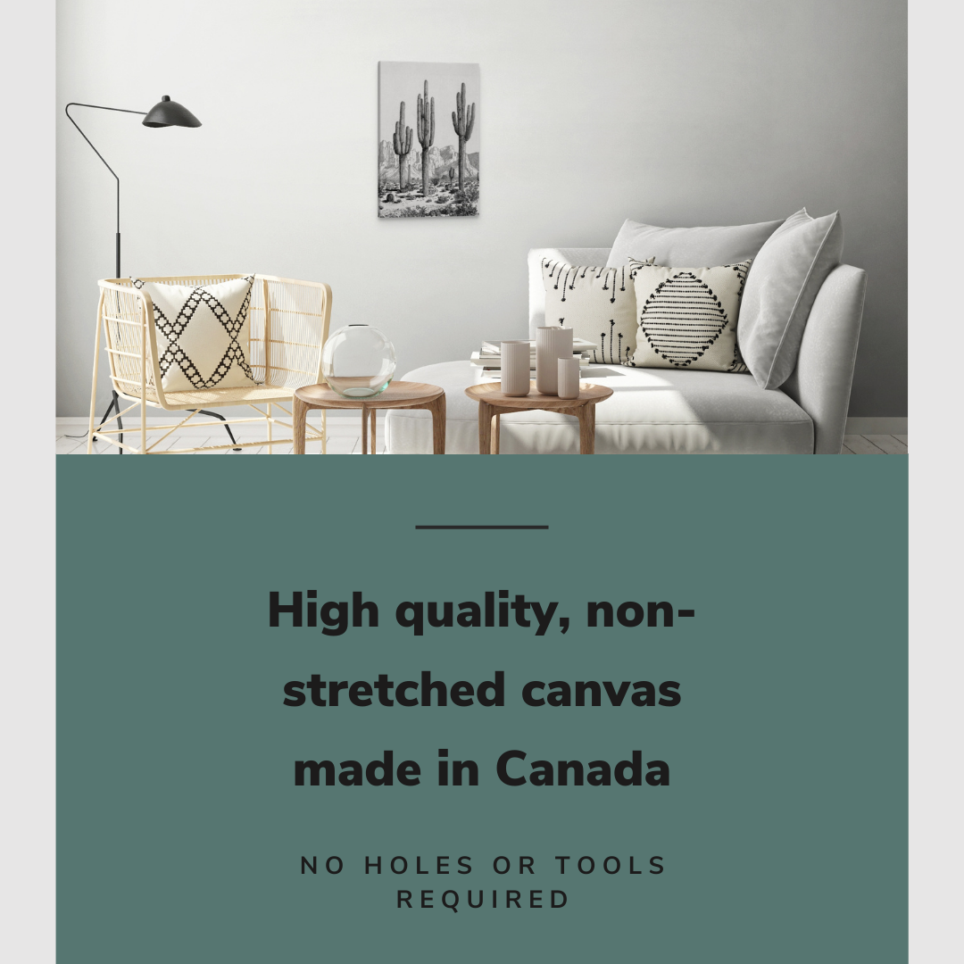 Lifestyle image of the vertical 16x24” inch easy to hang canvas wall art hung in a living room above a couch with graphic saying "High quality, non-stretched canvas made in Canada."