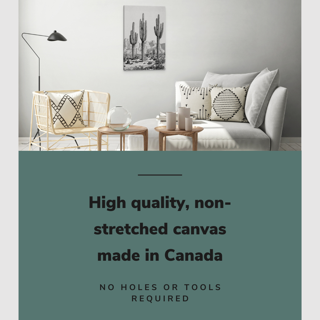 Lifestyle image of the vertical, 20x30” inch easy to hang canvas wall art hung in a living room above a couch with graphic saying "High quality, non-stretched canvas made in Canada"