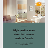 Lifestyle image of the 16x24" inch, vertical easy to hang canvas wall art hung in a chic living room overlooking a kitchen and dining room with graphic saying "High quality, non-stretched canvas made in Canada."