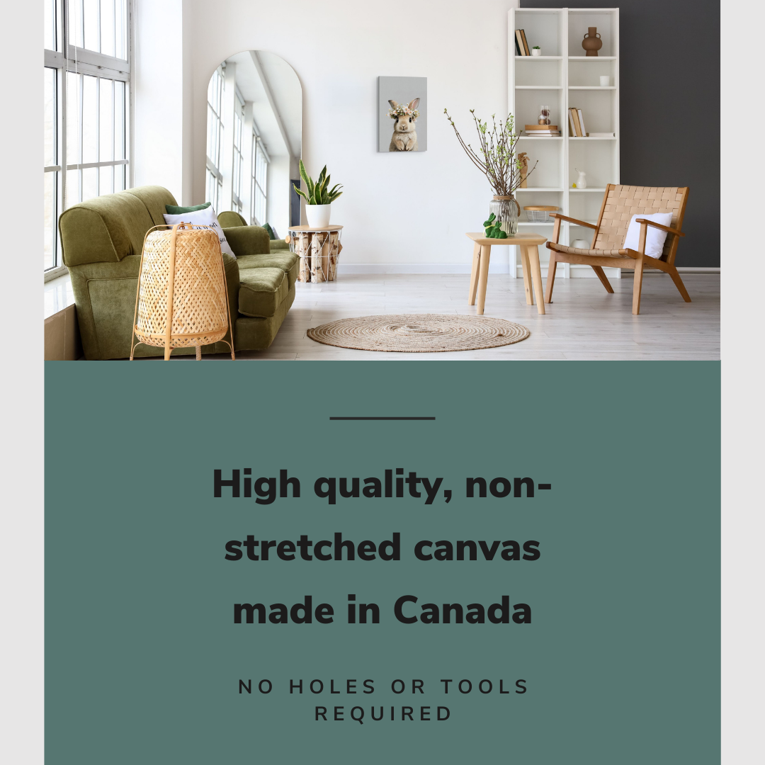 Lifestyle image of the vertical, 16x24 inch easy to hang canvas wall art hung in hung in a minimalist natural living room between a couch and an accent chair with graphic saying "High quality, non-stretched canvas made in Canada"