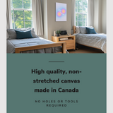 Lifestyle image of the vertical, 20x30 inch easy to hang canvas wall art hung in a dorm bedroom hung between two single beds with graphic saying "High quality, non-stretched canvas made in Canada"