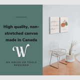 Lifestyle image of the vertical 20x30” inch set of 2 easy to hang canvas wall art hung in a living room above a reading chair with graphic saying "High quality, non-stretched canvas made in Canada"