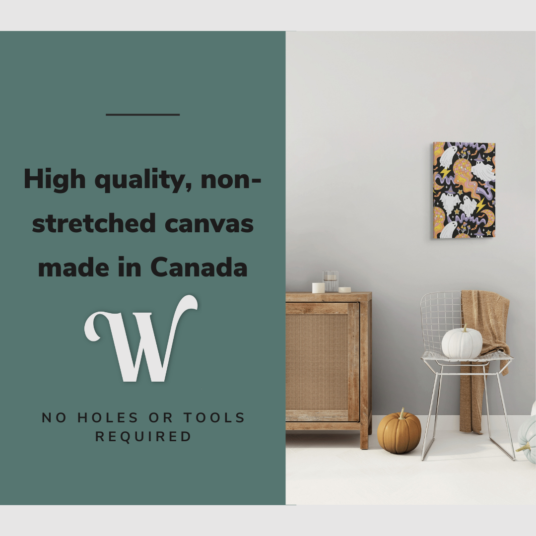 Lifestyle image of the vertical 16x24” inch easy to hang canvas wall art hung in a Halloween decorated living room above a chair with graphic saying "High quality, non-stretched canvas made in Canada."