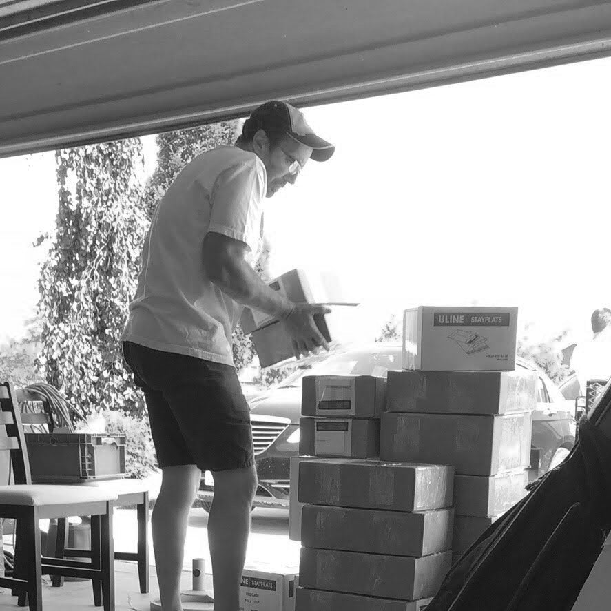 Mark dropping off some packages in his garage. 