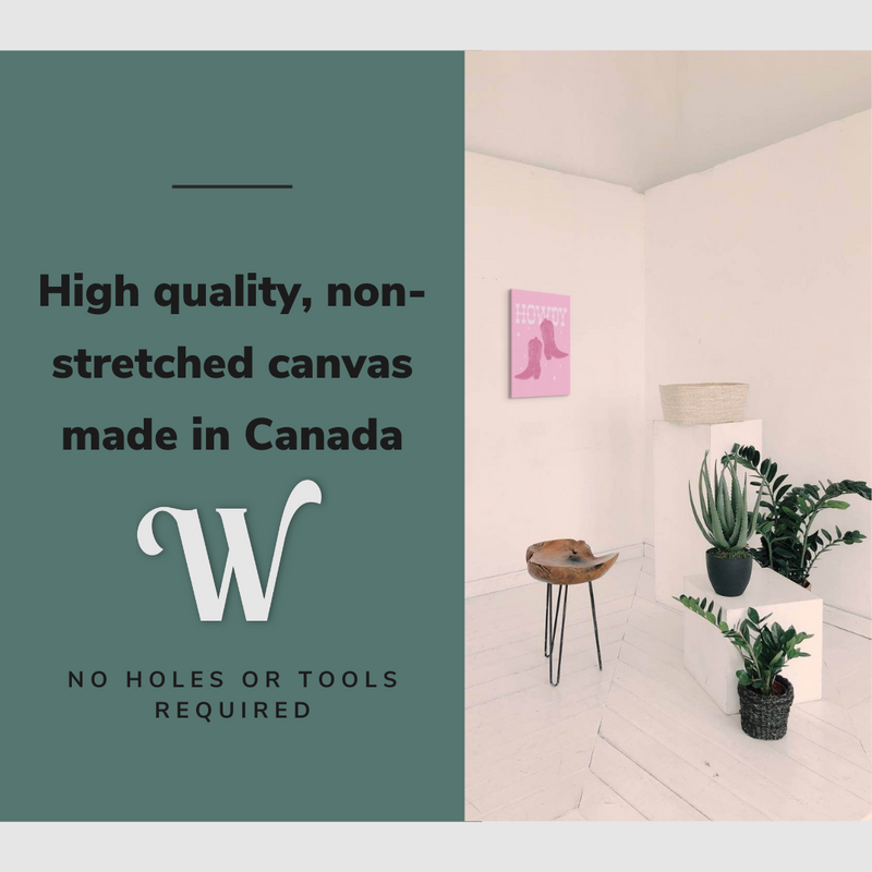 Lifestyle image of the vertical 16x24” inch easy to hang canvas wall art hung in a living room above some plants with graphic saying "High quality, non-stretched canvas made in Canada."