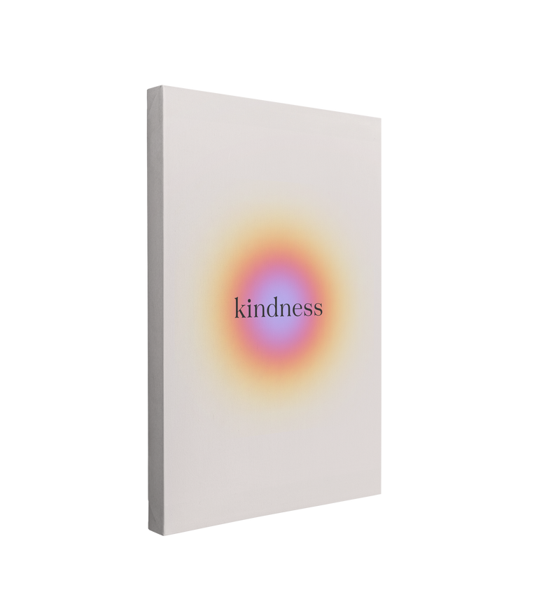 single, 2:3 vertical easy to hang canvas print on a transparent background featuring an image of a small gradient circle starting at a blue-purple in the middle and transitioning to an orange and yellow on a light beige background with the word, "Kindness" written on it in black. 