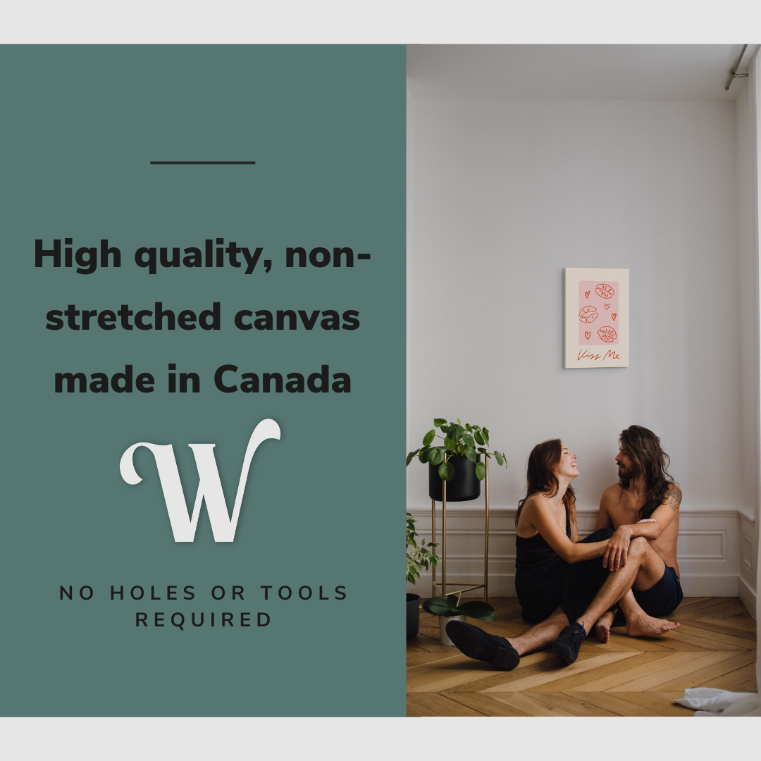 Lifestyle image of the vertical, 12x18 inch easy to hang canvas wall art hung in in a living room above a couple sitting on the ground with graphic saying "High quality, non-stretched canvas made in Canada"