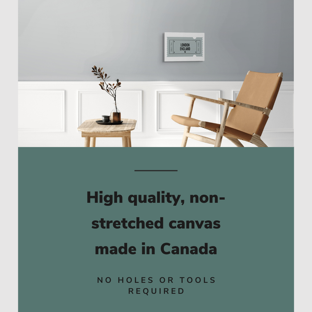 Lifestyle image of the horizontal 12x18” inch easy to hang canvas wall art hung in living room above a chair and table with graphic saying "High quality, non-stretched canvas made in Canada."