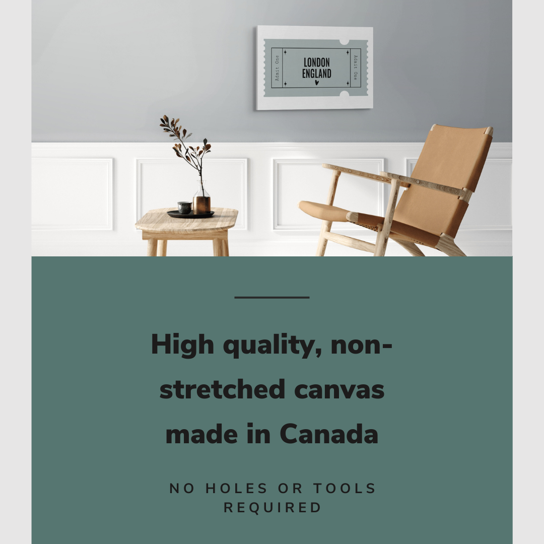 Lifestyle image of the horizontal, 20x30” inch easy to hang canvas wall art hung in a living room above a chair and table with graphic saying "High quality, non-stretched canvas made in Canada"